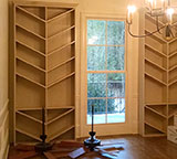 Photo of a dining room renovation with wine racks by MCM Homes, LLC